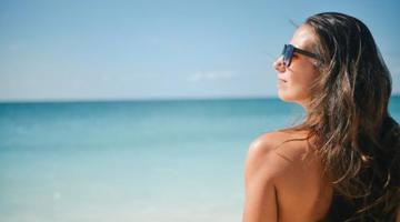 A young woman on a sunny beach