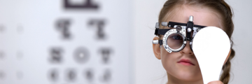 A young girl having an eye test