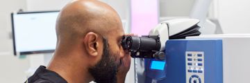 A member of the Moorfields using using ophthalmic equipment